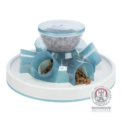 Feeding bowl with transparent container and blue tubes for dry food. Seal: Animal Welfare Compliant, inspection number 201711045.