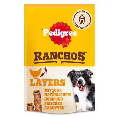 Pedigree Ranchos Layers s 100 % naravnim piščancem in svežo korenčko. Čvrsta in varna tekstura. Embalaža prikazuje psa in izdelek.