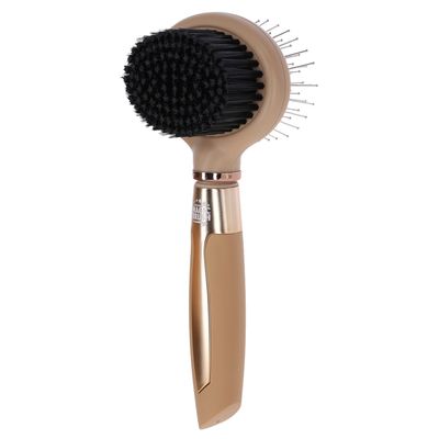 Magic Brush con design doppio: setole morbide su un lato, dentini in metallo sull'altro. Manico ergonomico con finitura dorata.