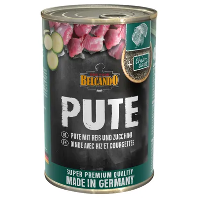 Lata de comida para perros Belcando Pute, con texto visible: 'Pute mit Reis und Zucchini', '+ Chia saat', 'Super Premium Quality Made in Germany'. Imagen de carne, calabacín y semillas.