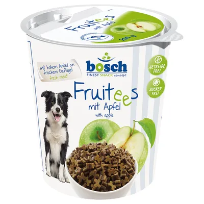 bosch Fruitees mit Apfel with apple, 200 g. Bild på hund, äpple och skål med små godisbitar. Text: mit hohem Anteil an frischem Geflügel fresh meat, getreidefrei, zuckerfrei.