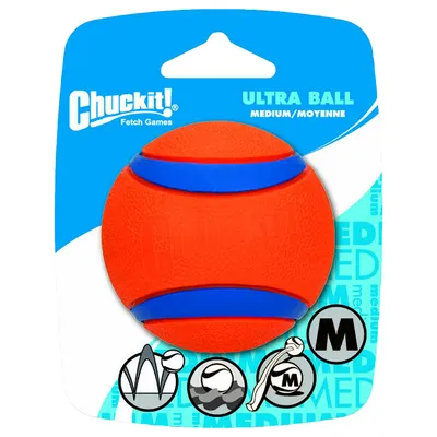 Chuckit! Fetch Games ULTRA BALL MEDIUM/MOYENNE, orange bold med blå striber i plastemballage. Ikoner og bogstavet M synlige på emballagen.