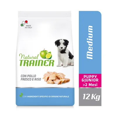 Natural Trainer hundefoder, Medium, Puppy & Junior >2 Mesi, 12 kg. Tekst: con pollo fresco e riso, con ingredienti specifici di origine naturale, Made in Italy. Billede af hvalp og kylling.