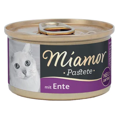 Miamor Pastete med and, NY: mild smag. Kattefoder i en guldfarvet dåse med lilla og sort etiket.