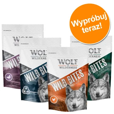 Cztery opakowania Wolf of Wilderness Wild Bites, różne warianty smakowe, napis na pomarańczowym kole: Wypróbuj teraz!