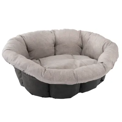 Letto per animali rotondo e imbottito in grigio con fondo nero. Tessuto morbido e bordi rialzati per comfort.