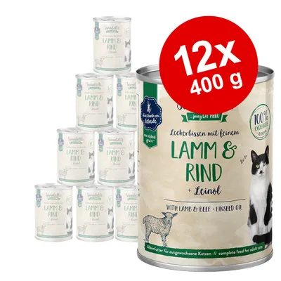 Sanabelle Lamm & Rind + Leinöl, 12×400 g konzerv pro kočky. Text: 100 % exkluzivní, no added grain, with lamb & beef • linseed oil. Obrázek kočky a ovce na etiketě. Sanabelle Lamm & Rind + Leinöl, 12×400 g konzerv pro kočky. Text: 100 % exkluzivní, no added grain, with lamb & beef • linseed oil. Obrázek kočky a ovce na etiketě.