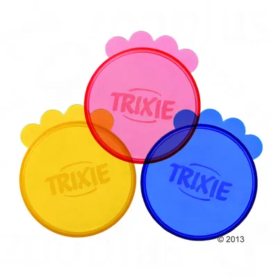 Three round plastic lids in pink, yellow and blue with paw-shaped tabs, each marked with the word TRIXIE.