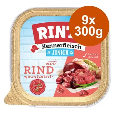 RINTI Kennerfleisch Junior met rund, graanvrij. 9x300g. Tekst: reich an Omega3. Afbeelding van vlees en groenten op de verpakking.