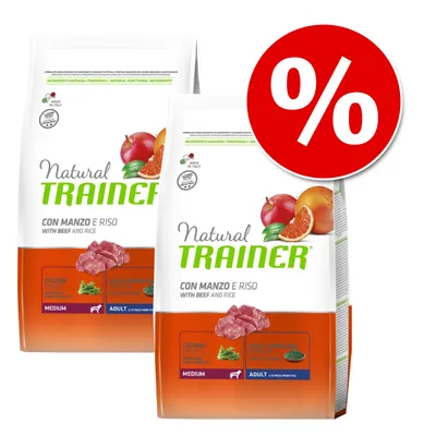 To sække Natural Trainer Con Manzo e Riso hundefoder, medium adult, med oksekød og ris. Stor rød procent-tegn cirkel indikerer tilbud eller rabat. To sække Natural Trainer Con Manzo e Riso hundefoder, medium adult, med oksekød og ris. Stor rød procent-tegn cirkel indikerer tilbud eller rabat.