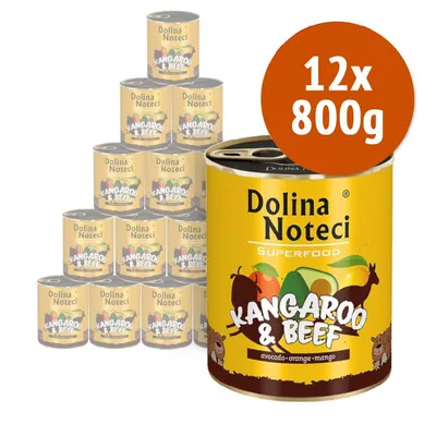 12 lattine da 800 g Dolina Noteci Superfood Kangaroo & Beef, avocado, arancia, mango. Etichetta visibile su ogni lattina.