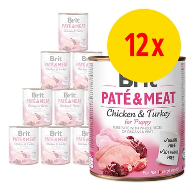 12x Brit PATÉ & MEAT Chicken & Turkey for Puppy. Synlige dåser med tekst: Grain free, Soy & GMO free. Billede af kylling og kalkun på emballagen.