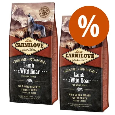 Due confezioni di Carnilove into the Wild Lamb & Wild Boar per cani adulti, scritte visibili: grain-free, potato-free, wild-origin meats, forest fruits, veggies & herbs, simbolo percentuale arancione.