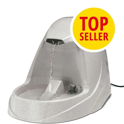 Fuente de agua eléctrica para mascotas en color gris claro con chorro de agua y etiqueta amarilla con texto 'TOP SELLER' en rojo.