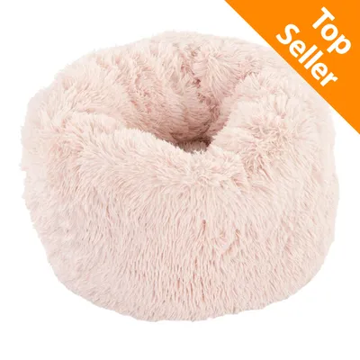 Cuscino rotondo in tessuto peluche rosa chiaro, etichetta arancione con testo Top Seller in alto a destra.