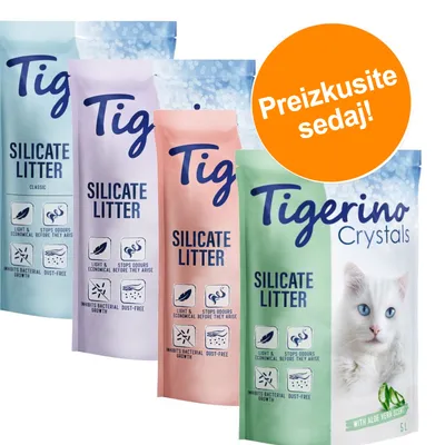 Več vreč peska za mačke Tigerino Silicate Litter, Classic in Crystals, z vidnimi ikonami: lahko, preprečuje vonjave, zavira rast bakterij, brez prahu. Oranžni krog z napisom: Preizkusite sedaj!