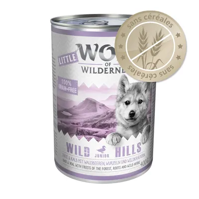Boîte de nourriture Little Wolf of Wilderness Wild Hills Junior, 400 g, étiquette 100% grain-free, canard et veau, badge sans céréales visible sur l’emballage.
