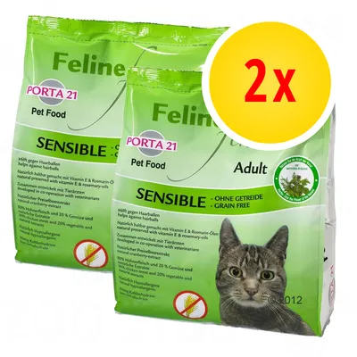 2 sacs de croquettes pour chat adulte Porta 21 Feline Sensible, sans céréales, avec photo de chat et texte visible en anglais et allemand sur les bienfaits et ingrédients.