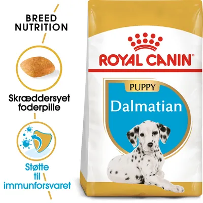 ROYAL CANIN PUPPY Dalmatian hundefoder, tekst: Breed Nutrition, Skræddersyet foderpille, Støtte til immunforsvaret. Billede af foderpille og dalmatinerhvalp på posen.