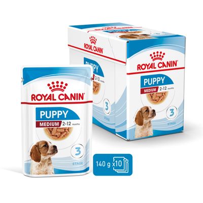 Royal Canin Puppy Medium 2–12 months, pachet cu 10 plicuri a câte 140 g, imagine cu ambalajul și cutia produsului, etapa 3, poza cu cățel pe ambalaj.