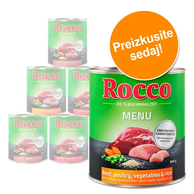 Rocco MENU konzerva 800 g, napis 'Beef, poultry, vegetables & rice', oznaka 'ENRICHED WITH CARBOHYDRATES', oranžen krog z besedilom 'Preizkusite sedaj!'.