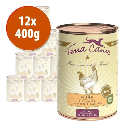 12 lattine da 400 g Terra Canis Huhn, alimento per cani con pollo, pomodoro, amaranto e basilico. Testo visibile in tedesco: 'Hausmannskost für Hunde', '100% Natur'.