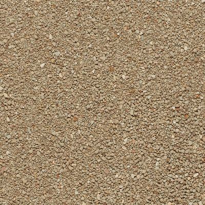 Primo piano di lettiera per gatti marrone-beige a grana fine.