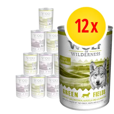 Wolf of Wilderness Green Fields koiran märkäruoka, 12 x 400 g. Etiketissä teksti: 100 % grain-free. Näkyvillä myös Wild Hills -variantti.