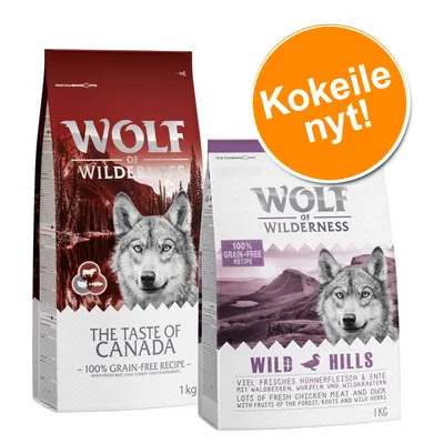 Wolf of Wilderness -koiranruokapakkaukset: The Taste of Canada ja Wild Hills, 1 kg. Teksti: 100% grain-free recipe. Oranssi ympyrä: Kokeile nyt!