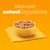 Bowl with food cubes on a yellow napkin, text: Made with natural ingredients. Bowl with food cubes on a yellow napkin, text: Made with natural ingredients.