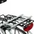 Porte-bagages arrière de vélo en métal noir et gris avec feu arrière rouge, fixé au-dessus de la roue arrière. Aucun animal ou accessoire supplémentaire visible.