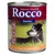Rocco Senior hondenvoer, 800 g blik. Tekst: Moderater Fettgehalt, Geflügel & Haferflocken. Pictogrammen: Ideales Ca/P, Leicht verdaulich, Kraft & Energie. Hond op grasveld zichtbaar.