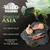 Wild Freedom Spirit of Asia. 40% fresh meat, 100% grain-free, ingredients typical to the region. Raw poultry, fish and greens shown on slate. Mountain landscape in background.