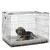 Wire pet crate with a cushioned mat inside, shown in use by an animal lying down to demonstrate size and comfort.