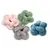 Vier zachte knopenballen van pluche in de kleuren roze, groen, grijs en blauw op een witte achtergrond. Vier zachte knopenballen van pluche in de kleuren roze, groen, grijs en blauw op een witte achtergrond.