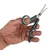 Hand holding a green pair of scissors with rounded tips and ergonomic handles, suitable for precise cutting.