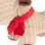 Jouet en peluche beige à rayures avec pattes marron et foulard rouge noué autour du cou, matière tissu visible.