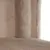 Close-up of beige plush fabric and textured material, possibly part of a scratching post or pet furniture.