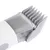 Close-up of electric pet hair clipper with grey plastic comb attachment and visible metal blades. No brand or text shown.
