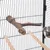 Bird cage with natural wood perch, two wooden perches and stainless steel food bowl. Metal bars.