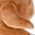 Close-up of a brown plush toy with soft texture and visible ear.