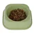 Green feeding bowl filled with brown and orange dry food pieces.