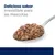 Delicioso sabor irresistible para las mascotas. Imagen de una cuchara con comida húmeda marrón.