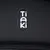 Tiaki. Logotip marke na crnom materijalu s vidljivim patentnim zatvaračem.