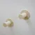 Two wooden wall mounts with cylindrical elements, partially wrapped with sisal rope. Suitable for scratching or climbing purposes.