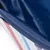 Close-up of a blue textured surface with red and blue stripes on a white background.