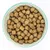 Bowl filled with dry, round pet food kibble pieces shown from above.