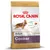 Royal Canin Adult Cocker hondenvoer, geschikt voor honden ouder dan 12 maanden. Tekst: Healthy skin & coat, ideal weight, cardiac tone. Afbeelding van een cocker spaniel en brokjes.
