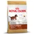 Bag labelled Royal Canin Junior Dachshund, up to 10 months old. Highlights joint and bone support, digestive health, natural defences, exclusive kibble shape, calcium and phosphorus.