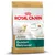 Royal Canin Golden Retriever Junior hondenvoer, tot 15 maanden. Tekst: Healthy skin and coat, Digestive health, Natural defences. Afbeelding van een jonge Golden Retriever op de verpakking.